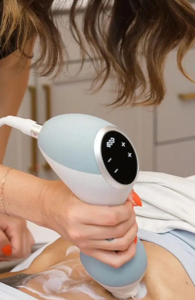 Woman getting treatment on belly