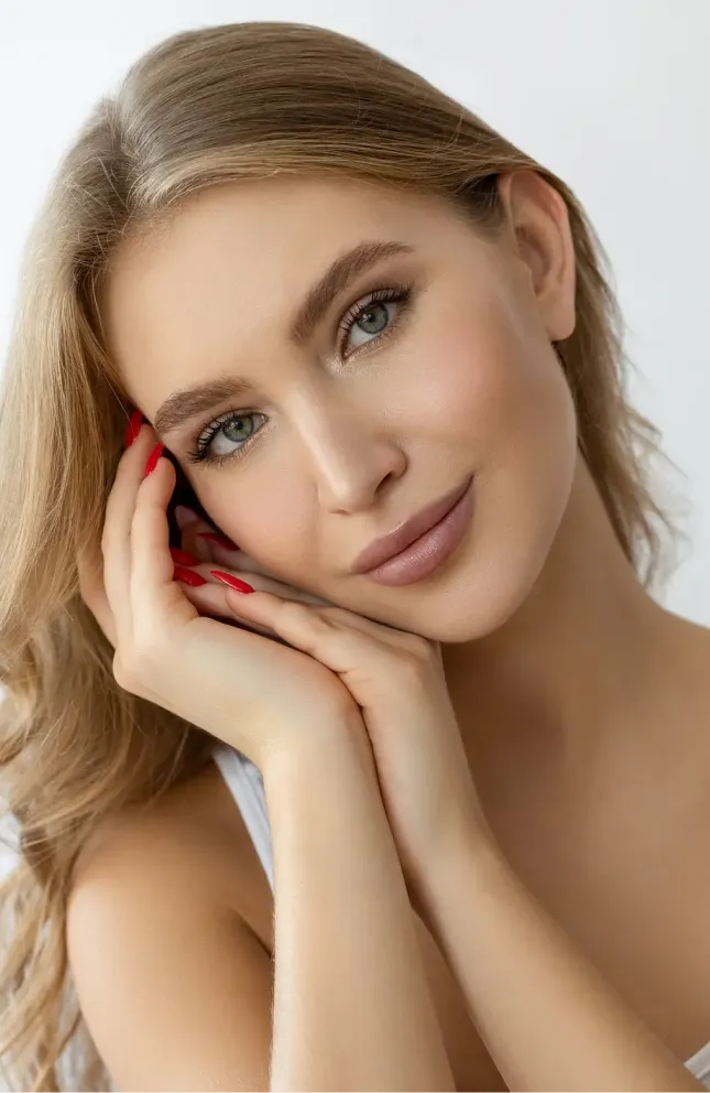 Woman with hands on cheeks
