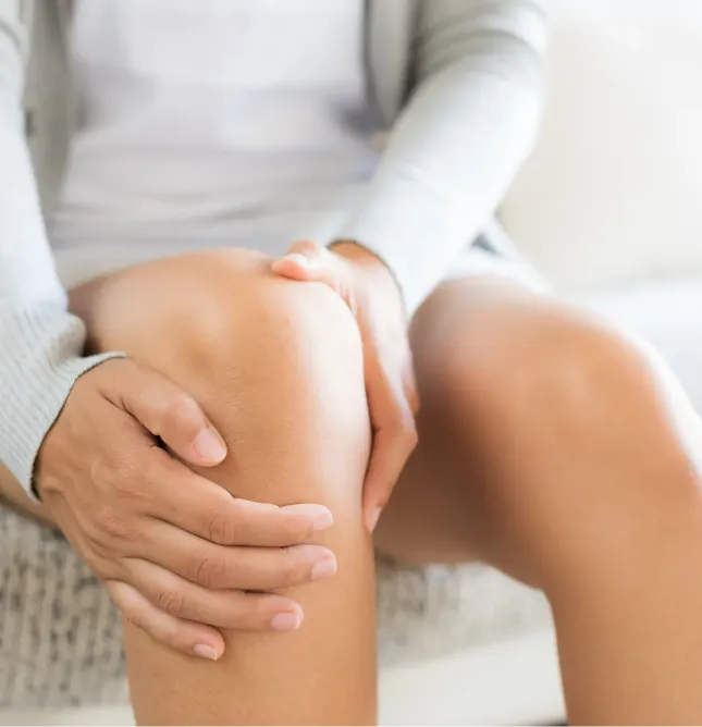 Woman holding knee