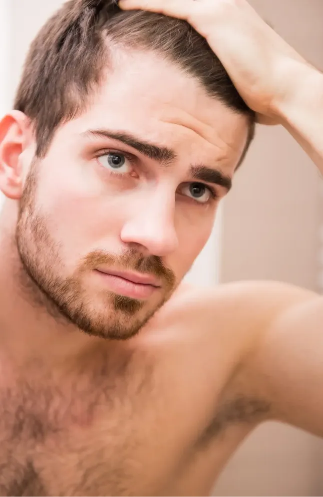 Man checking hair line