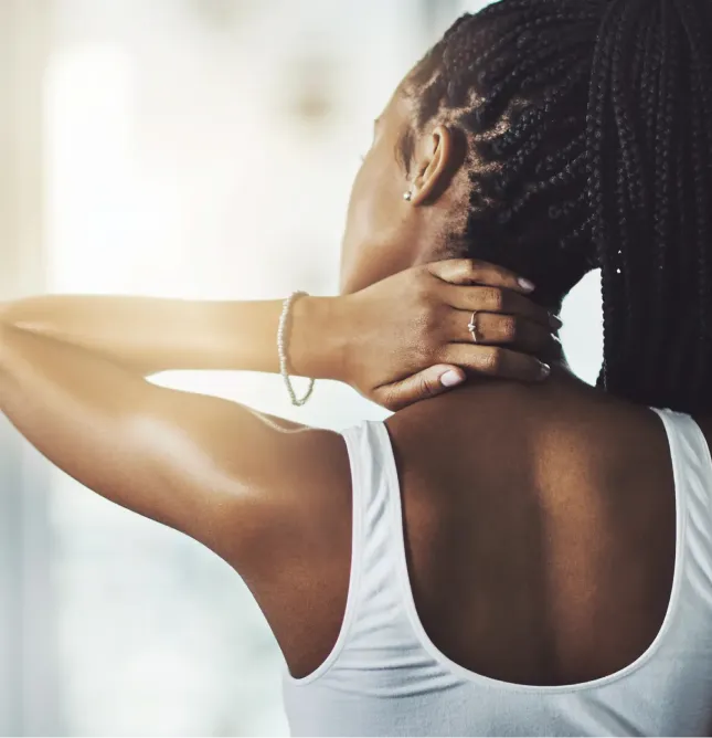 Woman with hand on back of neck